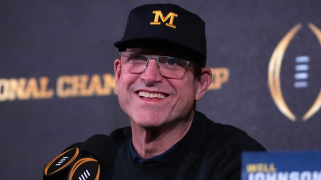 Wolverines coach Jim Harbaugh chats with the media during a College Football National Championship press conference.